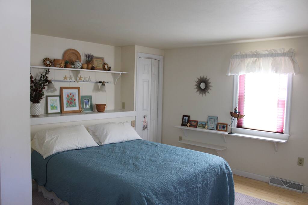 Master bedroom with queen bed on the first floor.