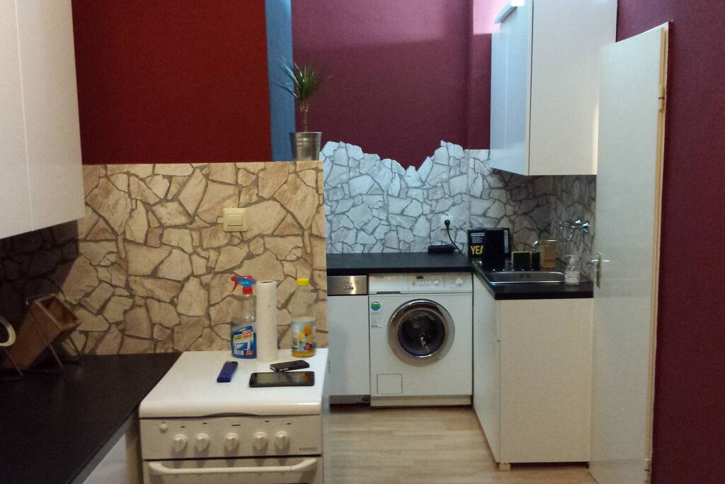 kitchen with washing machine, dishwasher and gas stove