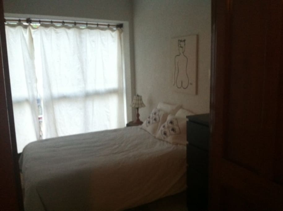 Guest bedroom, curtains closed. Curtains now completely block out light.