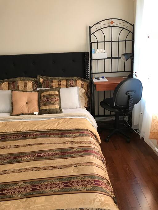 Laptop work area in bedroom