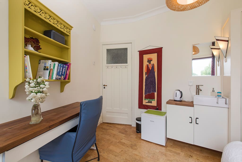 There is a small desk which you can also use as a table