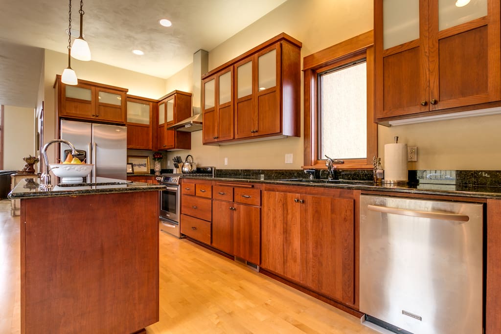 Designer kitchen with granite counters and KitchenAid appliances