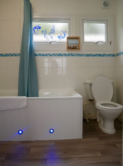Bathroom complete with shower/bath, led mirror, motion censored lights, silent extractor fan and heated towel rail