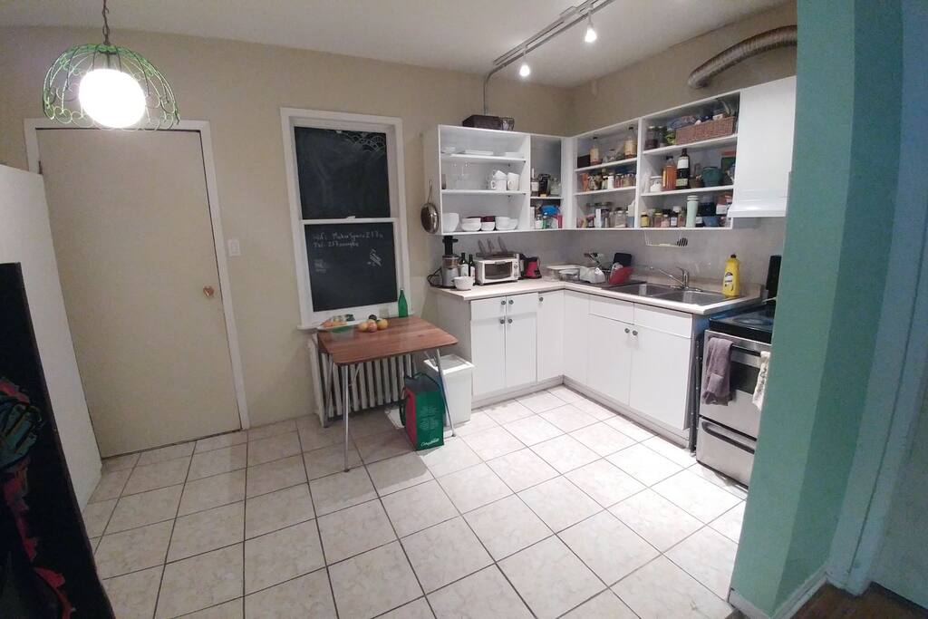 The kitchen is equipped with all the essentials including a blender and a juicer.