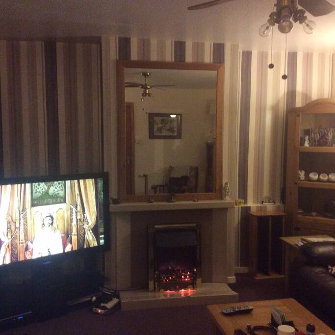 Warm cozy sitting room with views across the loch to Skye and Torridon mountains