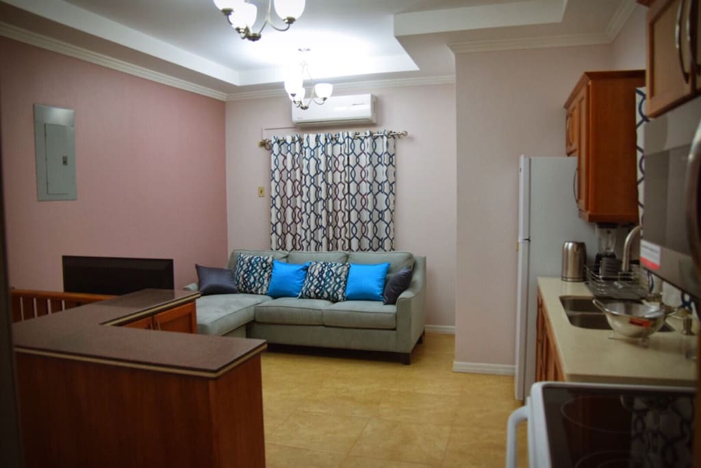 View of living room and kitchen upon entry