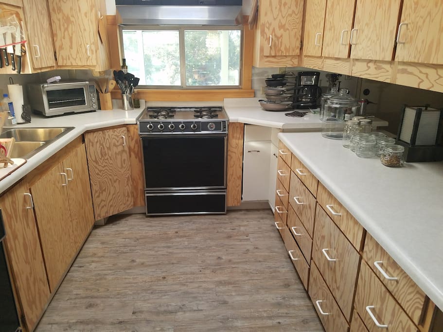 Kitchen with dishwasher, gas stove and toaster oven
