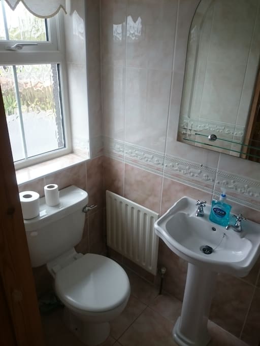 En-suite with electric shower.