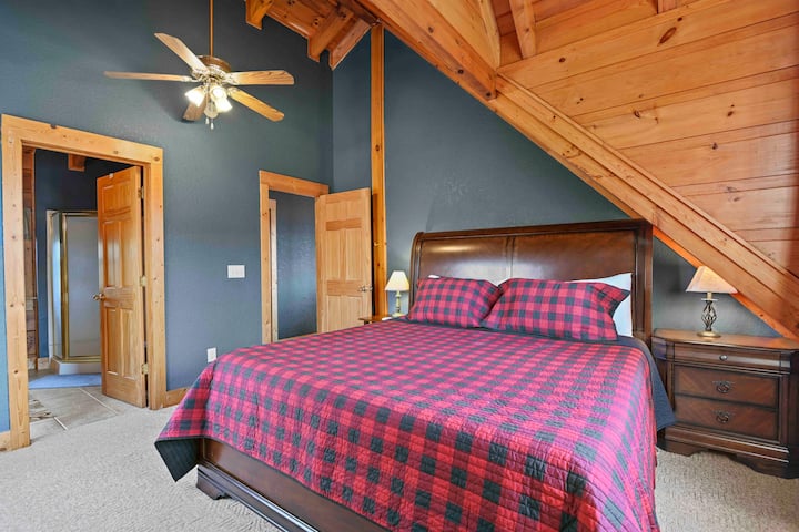 Primary bedroom on the upper level with king bed.