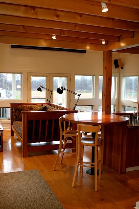 The living area has custom-built furniture made of cherry harvested from the farm