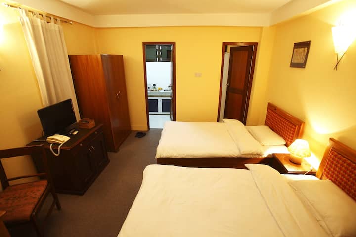Chambre studio avec lits jumeaux
