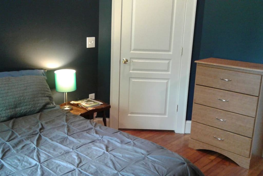 Bed, dresser in music room