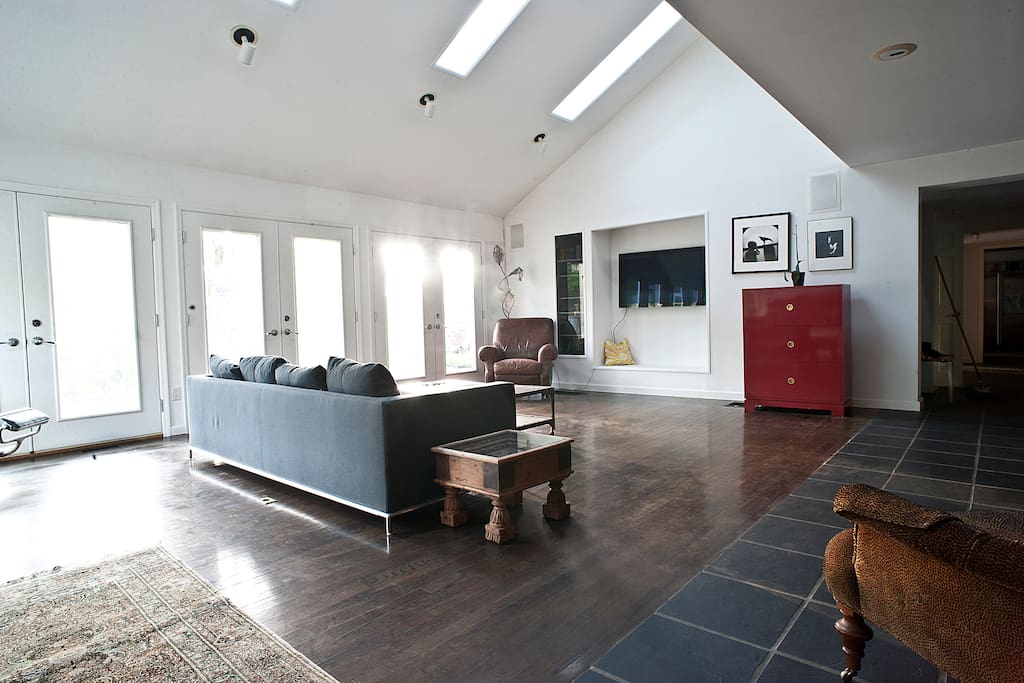 Large living room with high ceilings and access to patio