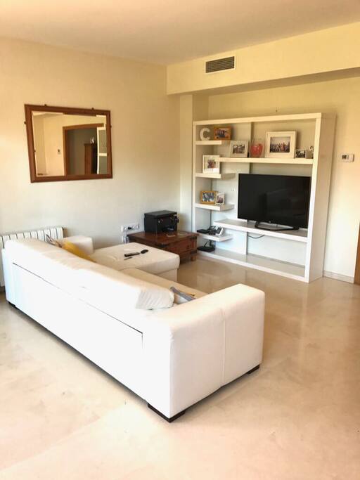 The main lounge is light and great for relaxing. The sofa can become a bed if required.