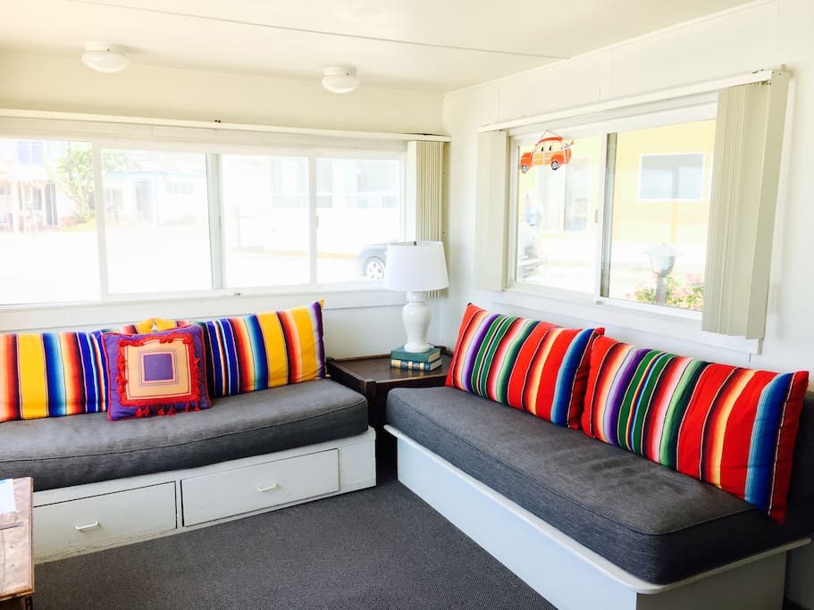 Both couches in the living area turn into custom twin beds providing more sleeping space in the common area.
