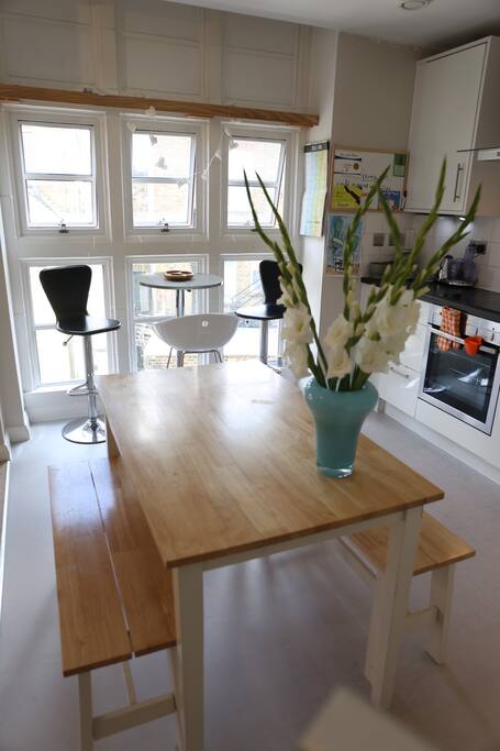 Kitchen area with breakfast table and dinning table