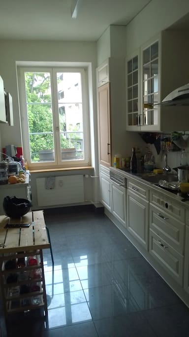 big shared kitchen with microwave, oven, dishwasher, fridge