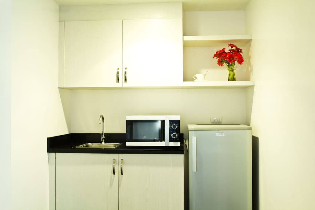 The Premiere Suite Room features a Kithchenette equipped with a 6 cubic Refrigerator, Microwave and an electric hot pot.