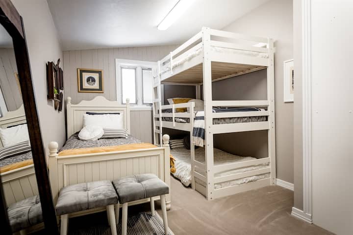 The bunk room for kids sleepovers including 4 twin beds.