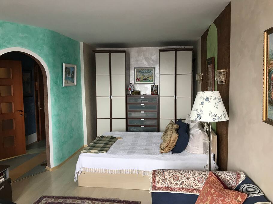 The wardrobe and queen-sizes bed.