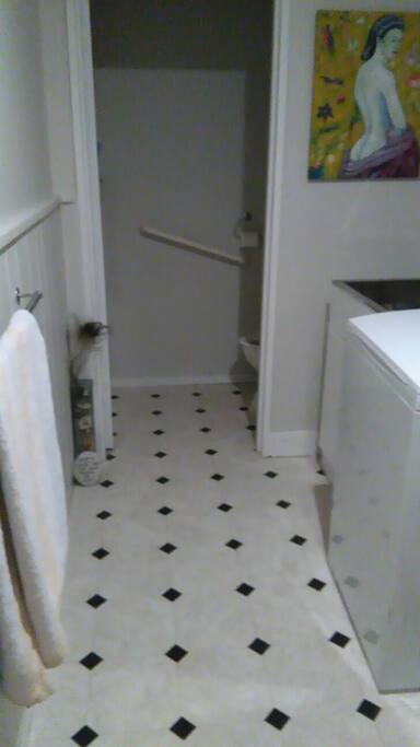 bathroom with attached toilet