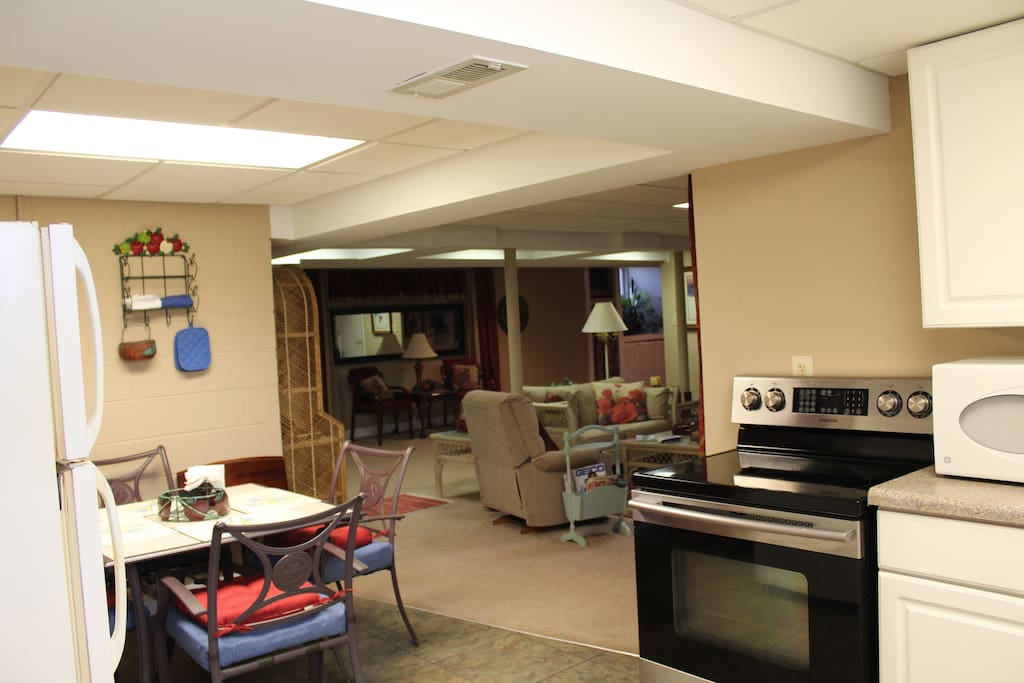 Kitchen in unit includes full range stove, microwave, coffee pot, toaster oven/rotisserie, and other kitchen utensils and appliances.