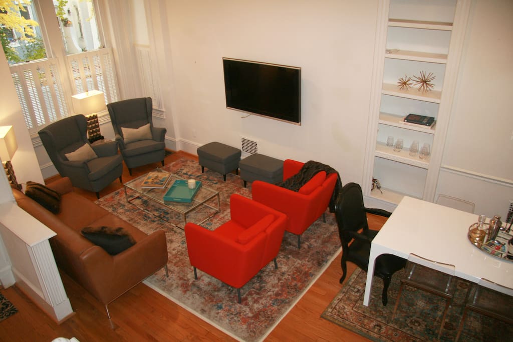 Beautiful Living Room, Featuring Leather Sofa, Upholstered Chairs, & Flat Screen TV