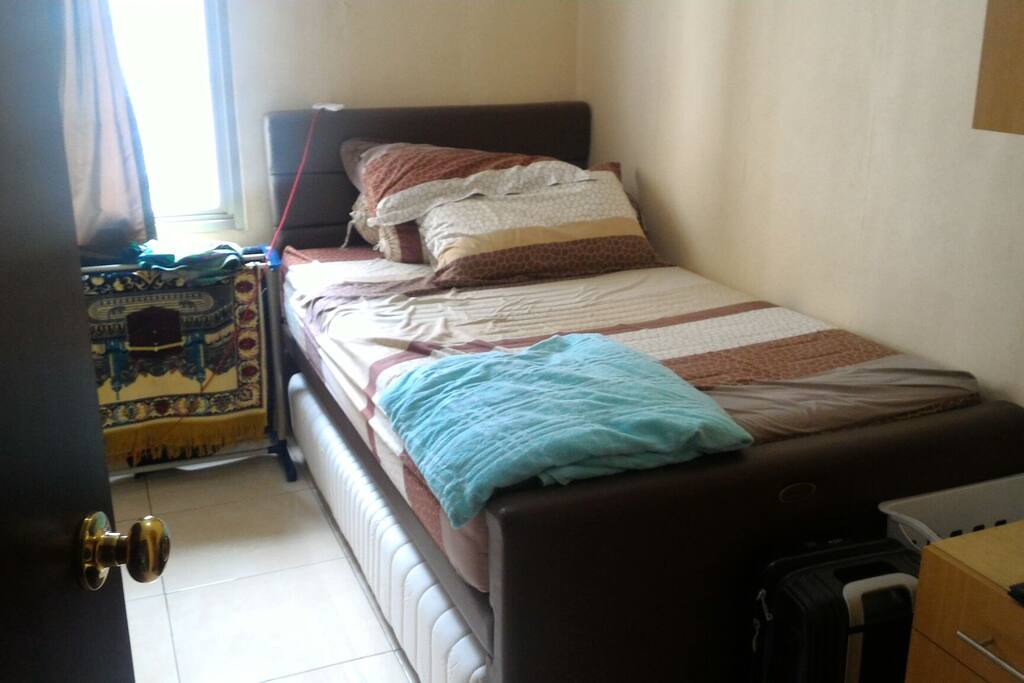 Your Room, the second bed is the white one under the bed.