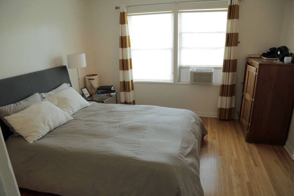 Get spoiled on Room & Board encased coil Queen mattress with great pillows and quality linens.