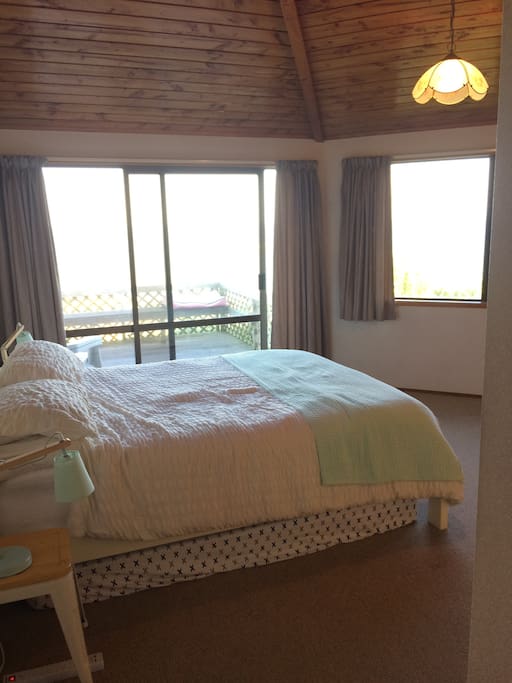 Master bedroom with private deck and sea view