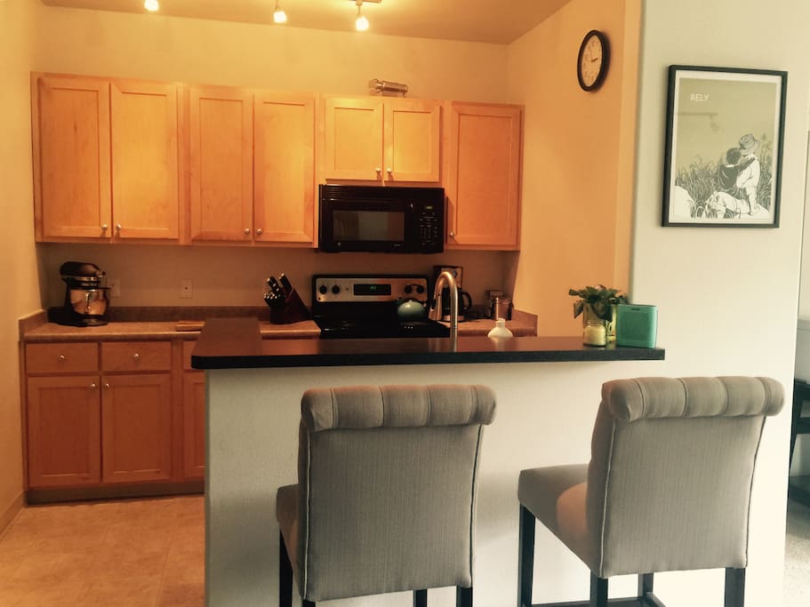 We have a beautiful kitchen with a stainless steal stove and refrigerator. This also includes a microwave, toaster, blender, mixer, and just about anything else you might need to cook in.