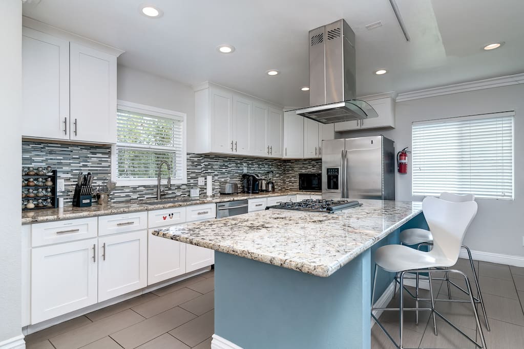 Exquisite kitchen includes amenities such as a Keurig coffee maker, toaster, and blender.