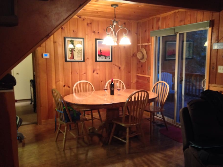 Dining room with solid oak table. We have a couple extra chairs if needed.