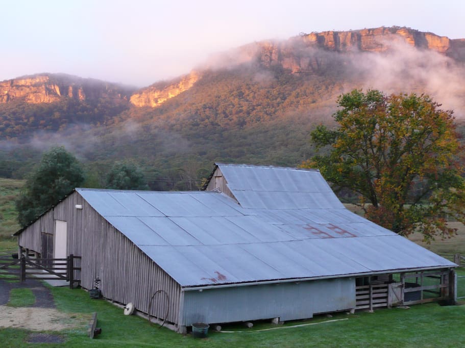 Sunset colour and a some mist on the mountain. Your view from cabin deck
