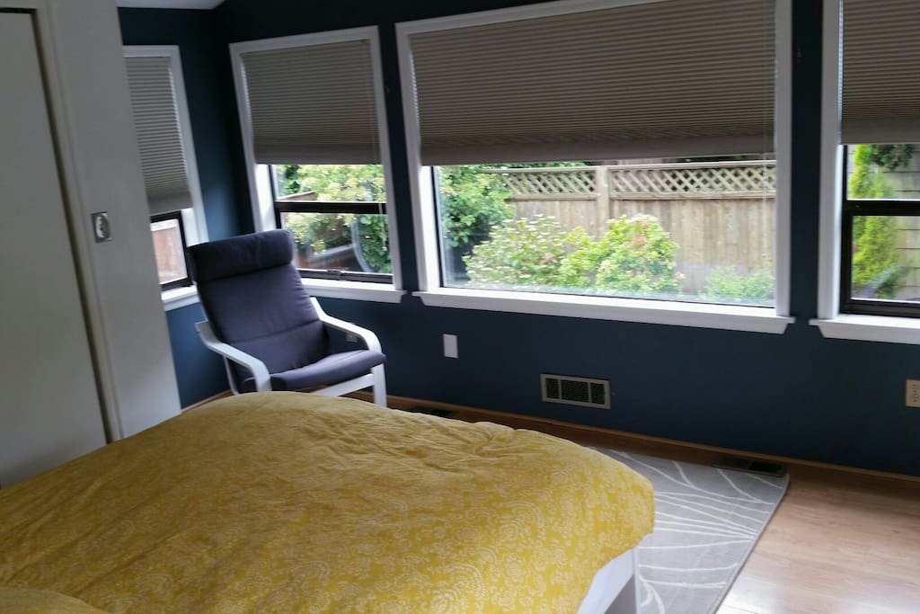 Upstairs bedroom overlooking the backyard. (A small desk and reading area are in this room)