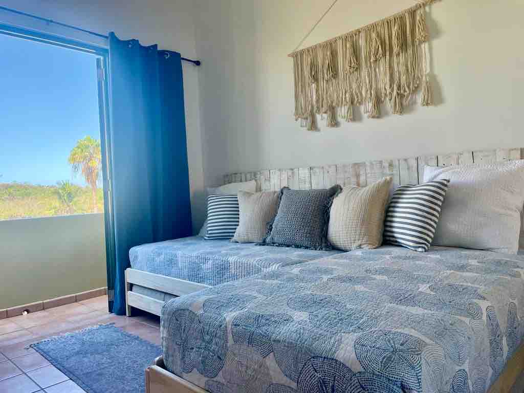 second floor bedroom, sleeps up 3. Also convertible to a king size bed. Let us know ahead so we can prepare for you.