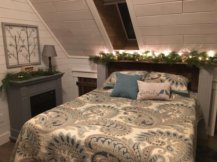 Lofted bedroom with  half bath.