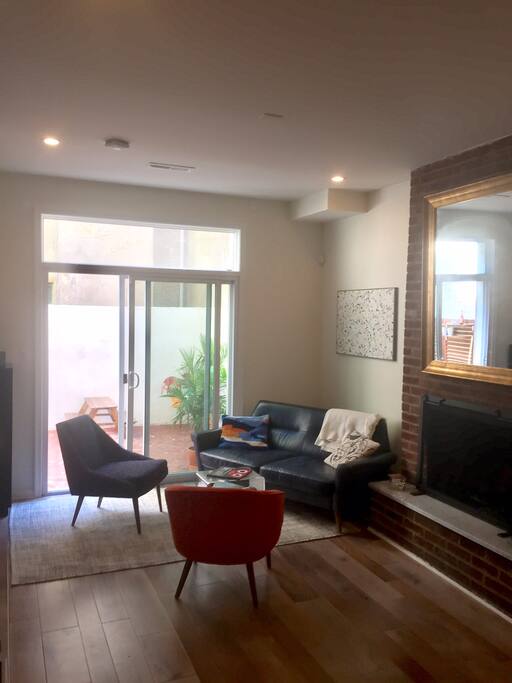 Living area / fireplace, opens onto back patio with grill