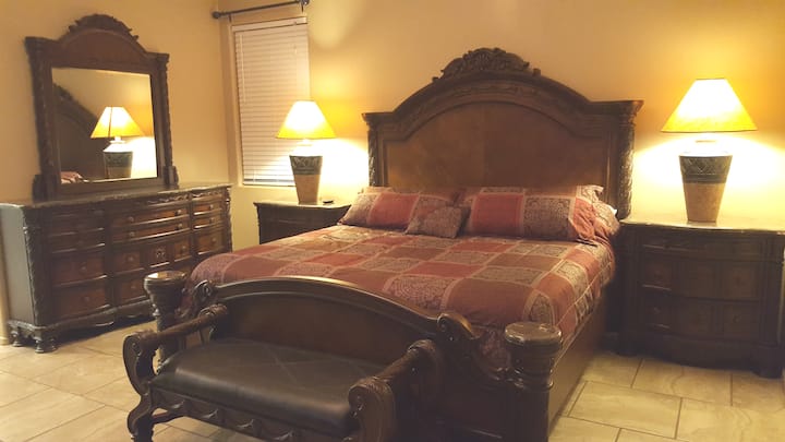 Master bedroom-King size with dresser/mirror, night stands, media chest, and bench