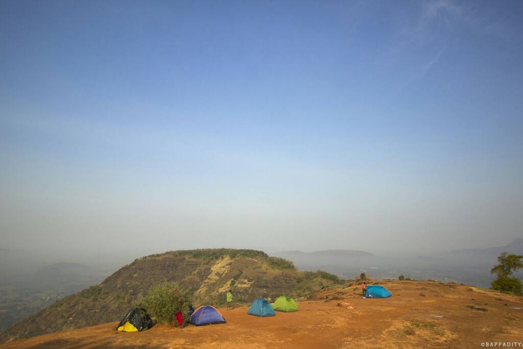 Camping under bright blue skies.