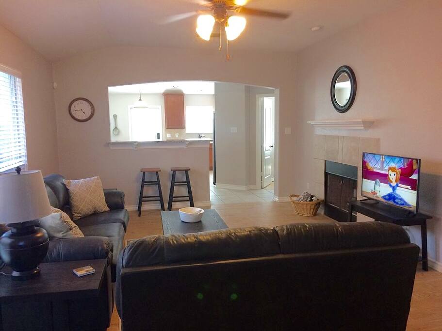 Welcome to your home away from home! Living room and kitchen from the front door.