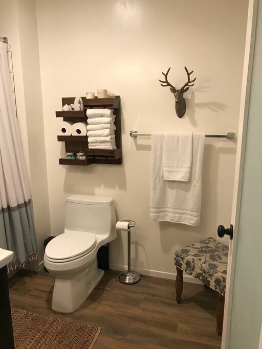 Clean and stocked bathroom.