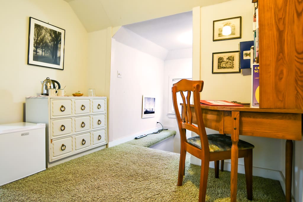 Mini-fridge and teakettle.