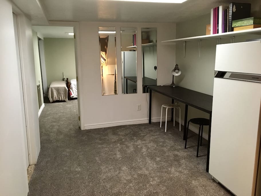 This is a private desk and fridge. The laundry machines that are in the basement are the only part that is shared.