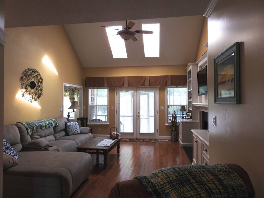 Living Room with French doors that open to the screened in porch and top deck.