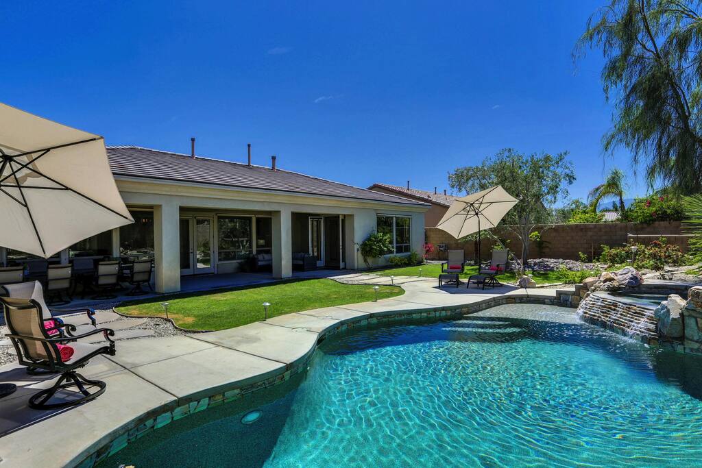 Stunning blue waters with waterfall jacuzzi in your California paradise