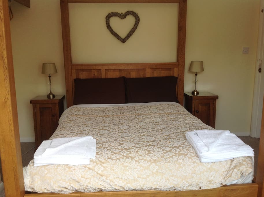 Bespoke solid oak four poster bed with matching furniture