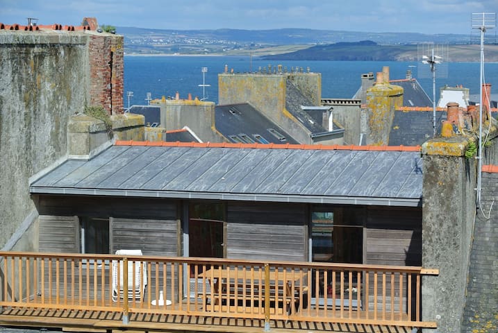 Bright attic room with bay views