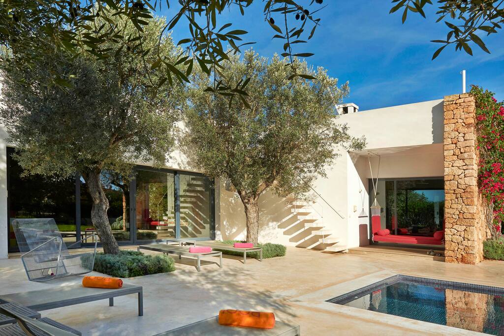The immaculate terraces surrounding the pool.