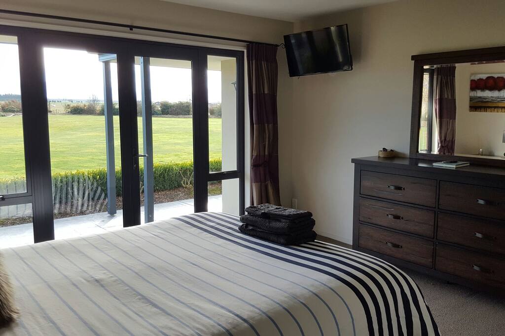 Master bedroom which has its own ensuite and private access to the hot tub.